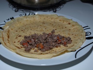 Crêpes with meat in creamy chanterelle sauce